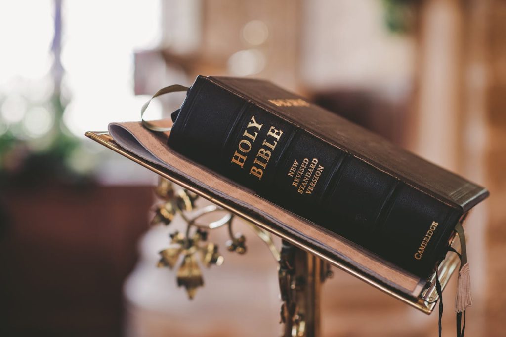 Holy Bible open on a stand, symbolizing faith and spirituality.