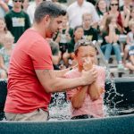 A joyful outdoor baptism ceremony in Clemson, SC, celebrating faith and community.